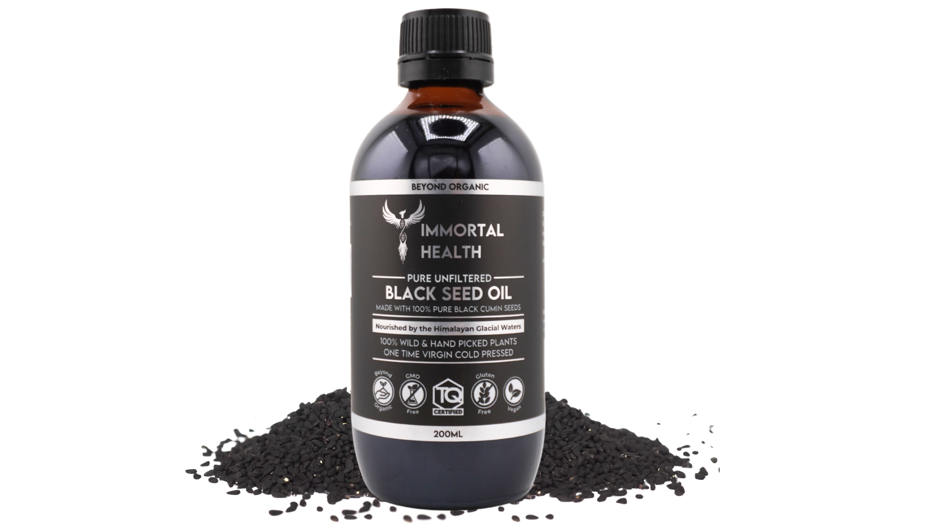 black seed oil bottle with seeds around it